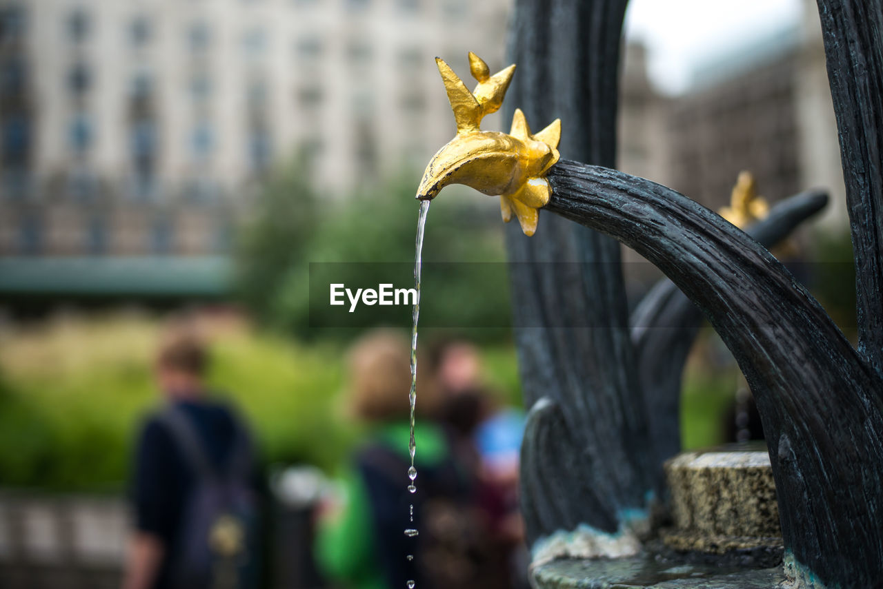 Antique fountain in city