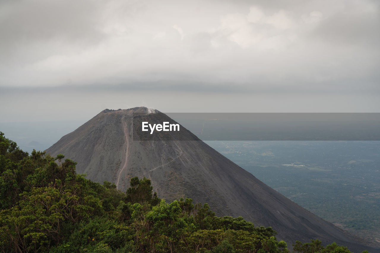 Scenic view of volcanic mountain against sky