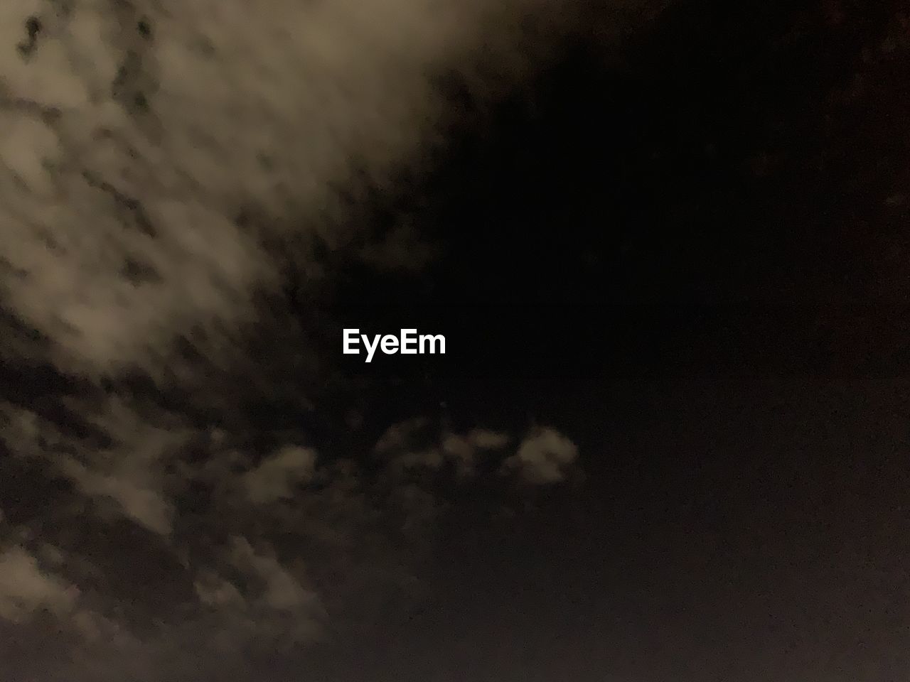 LOW ANGLE VIEW OF MOON IN SKY