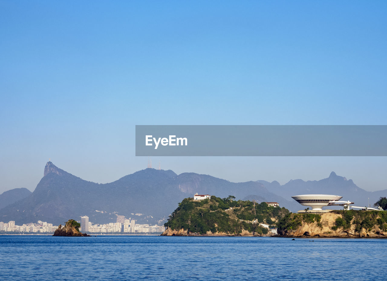 SCENIC VIEW OF LAKE AGAINST CLEAR BLUE SKY