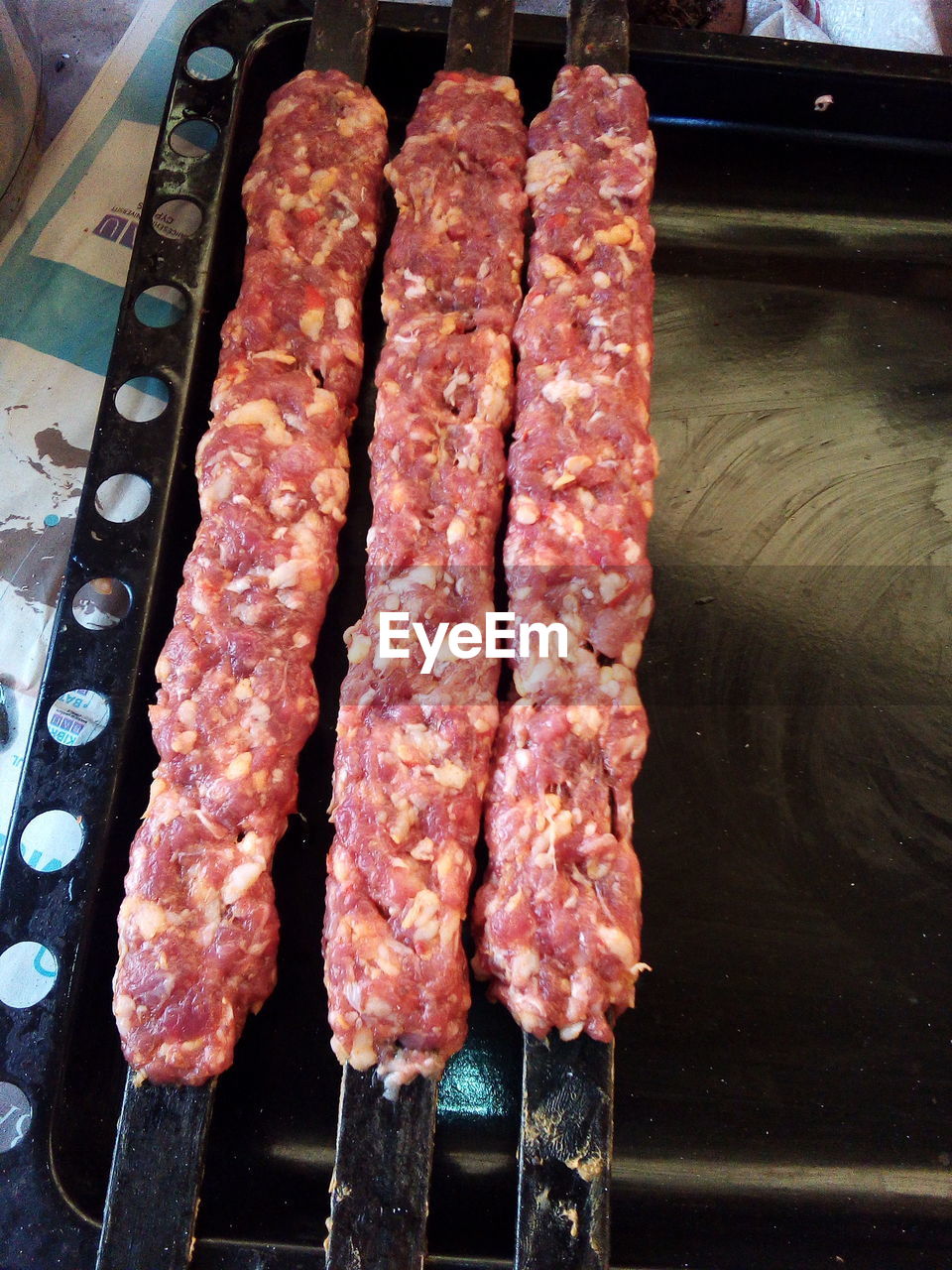 HIGH ANGLE VIEW OF MEAT ON BARBECUE