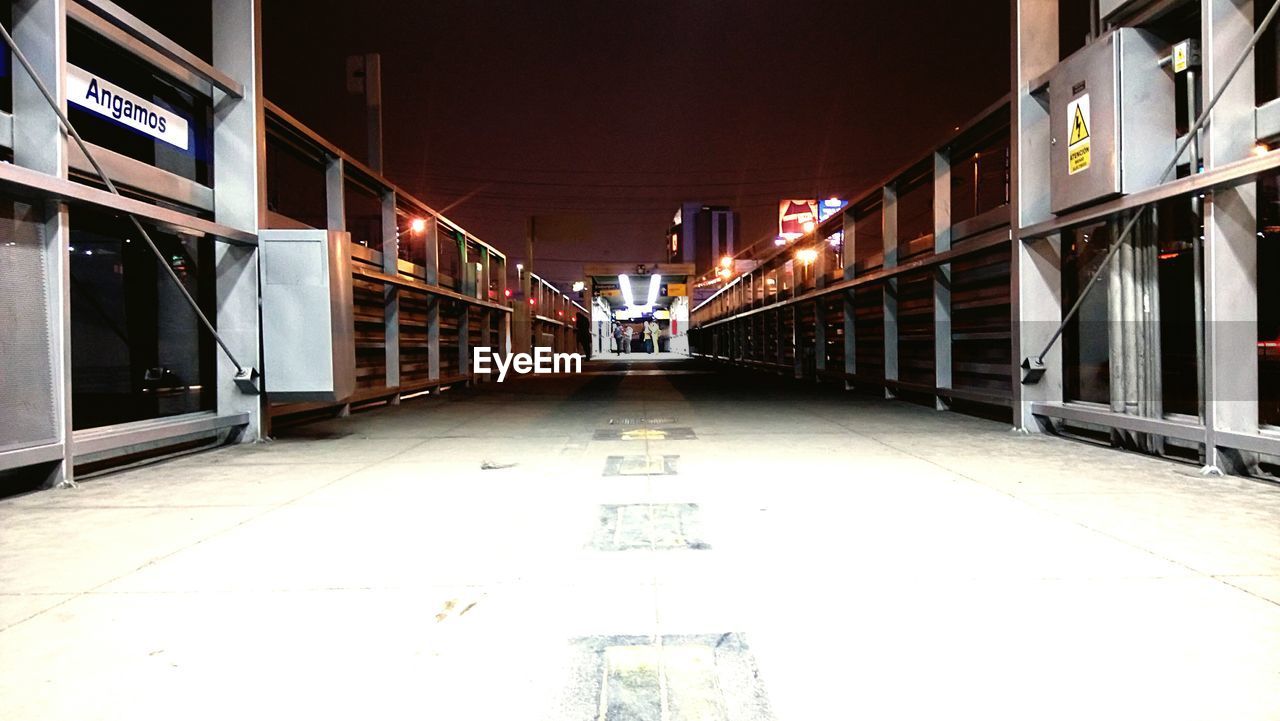 TRAIN AT RAILROAD STATION PLATFORM AT NIGHT