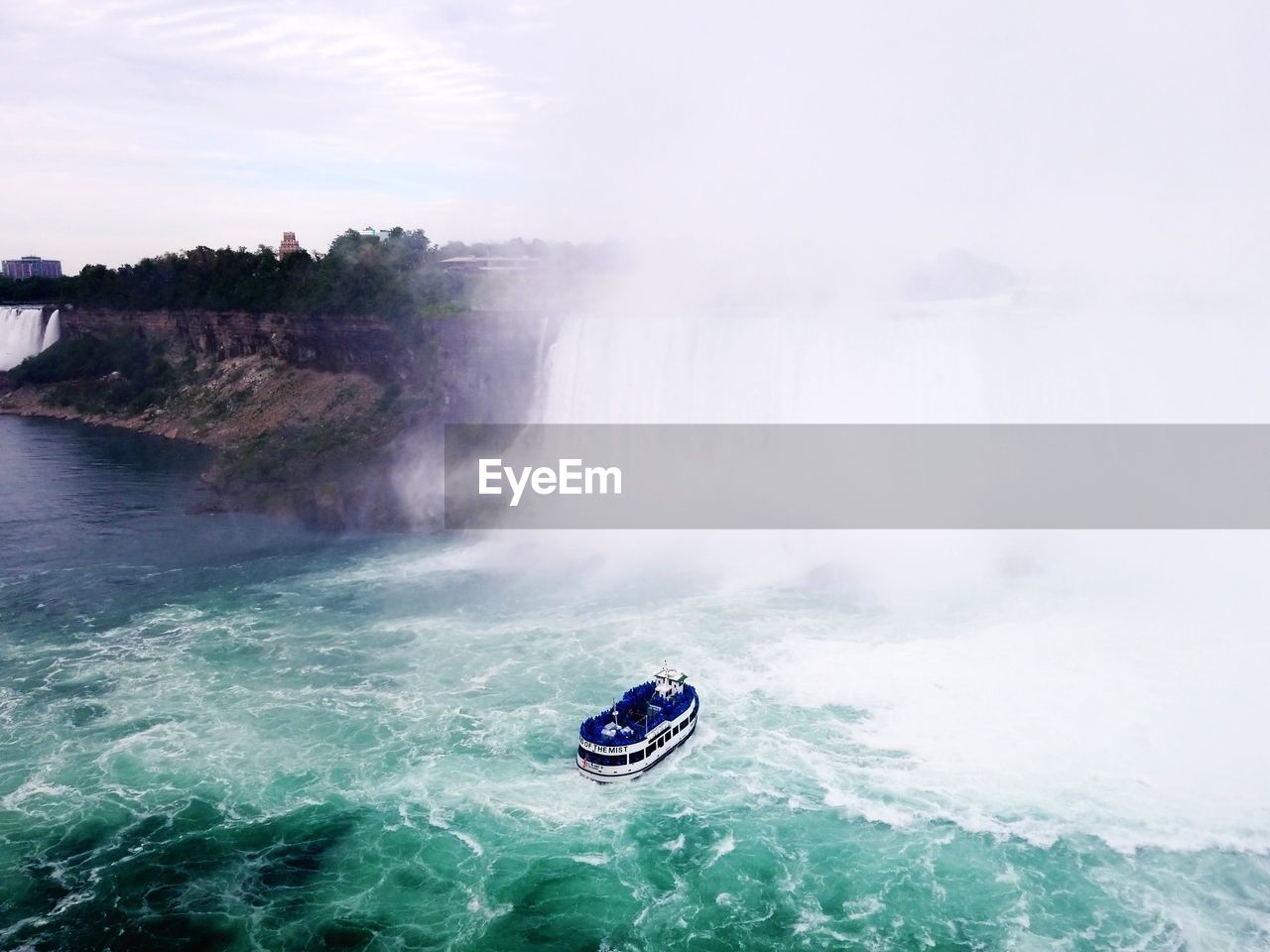 SCENIC VIEW OF SEA AGAINST WATERFALL