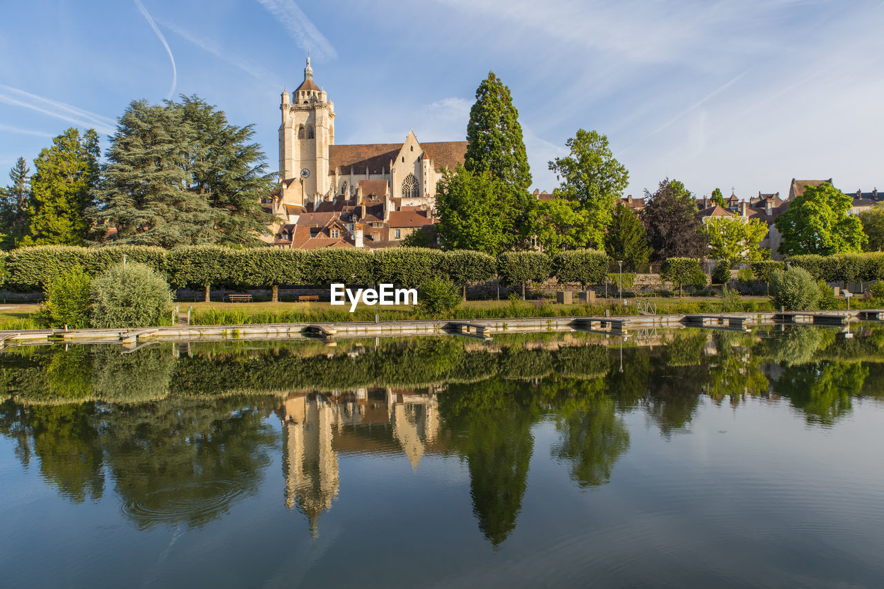 reflection, water, architecture, built structure, sky, building exterior, building, nature, tree, travel destinations, plant, history, religion, château, the past, lake, travel, place of worship, landscape, city, tourism, cloud, no people, belief, blue, environment, business finance and industry, outdoors, beauty in nature, house, flower, spirituality, tower, tranquility, estate, industry, mansion, construction industry, home, scenics - nature, temple - building, old
