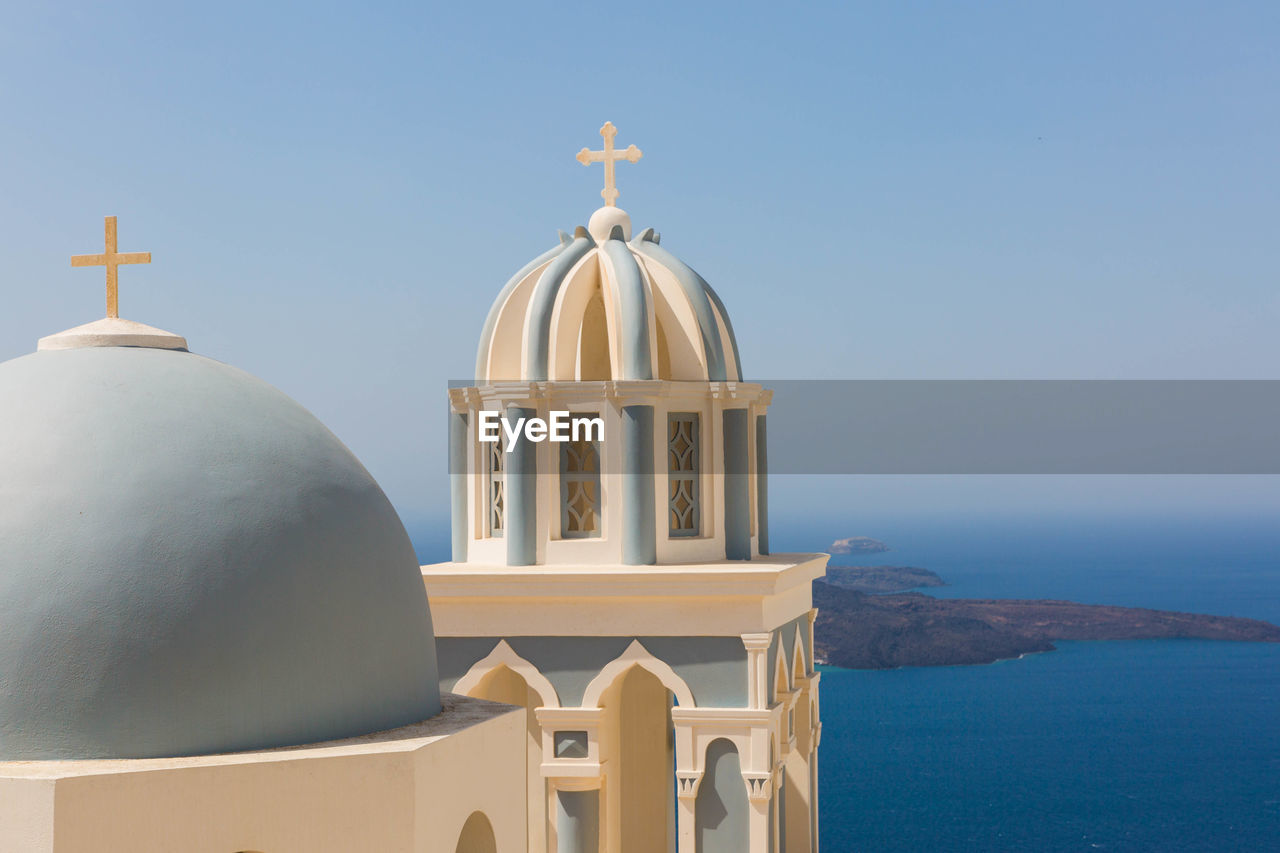 Close-up of church by aegean sea against sky