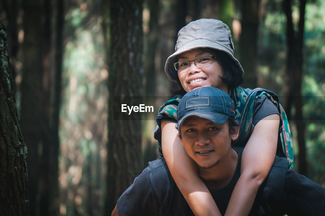 Portrait of happy smiling couple in forest