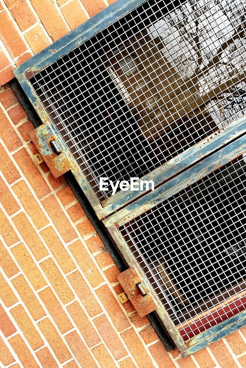 HIGH ANGLE VIEW OF WINDOW ON FOOTPATH