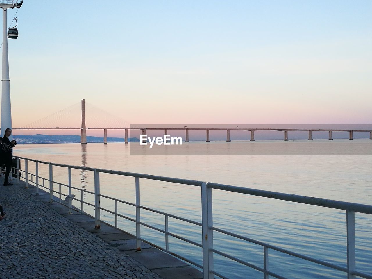 VIEW OF SEA AGAINST CLEAR SKY DURING SUNSET