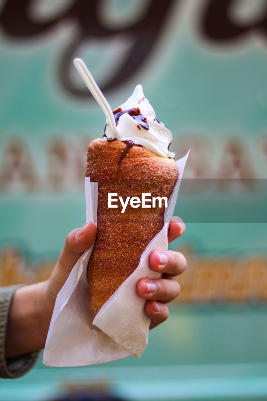 Close-up of hand holding ice cream