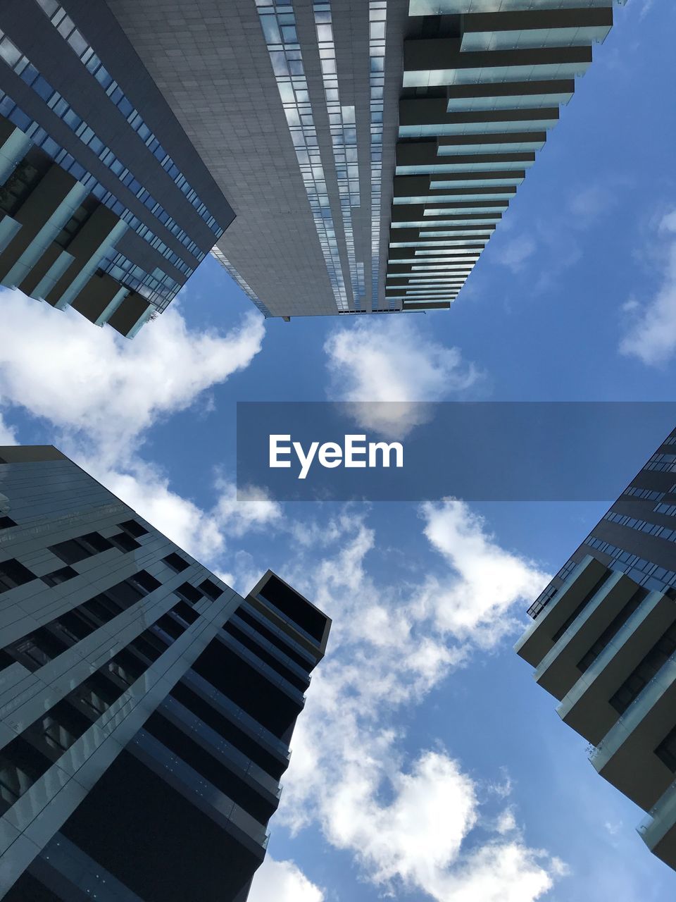 Low angle view of modern buildings against sky