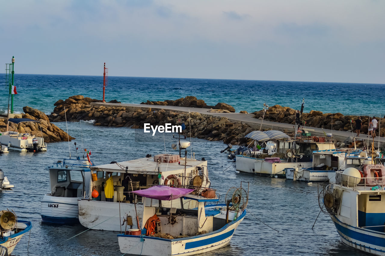 BOATS MOORED AT SEA