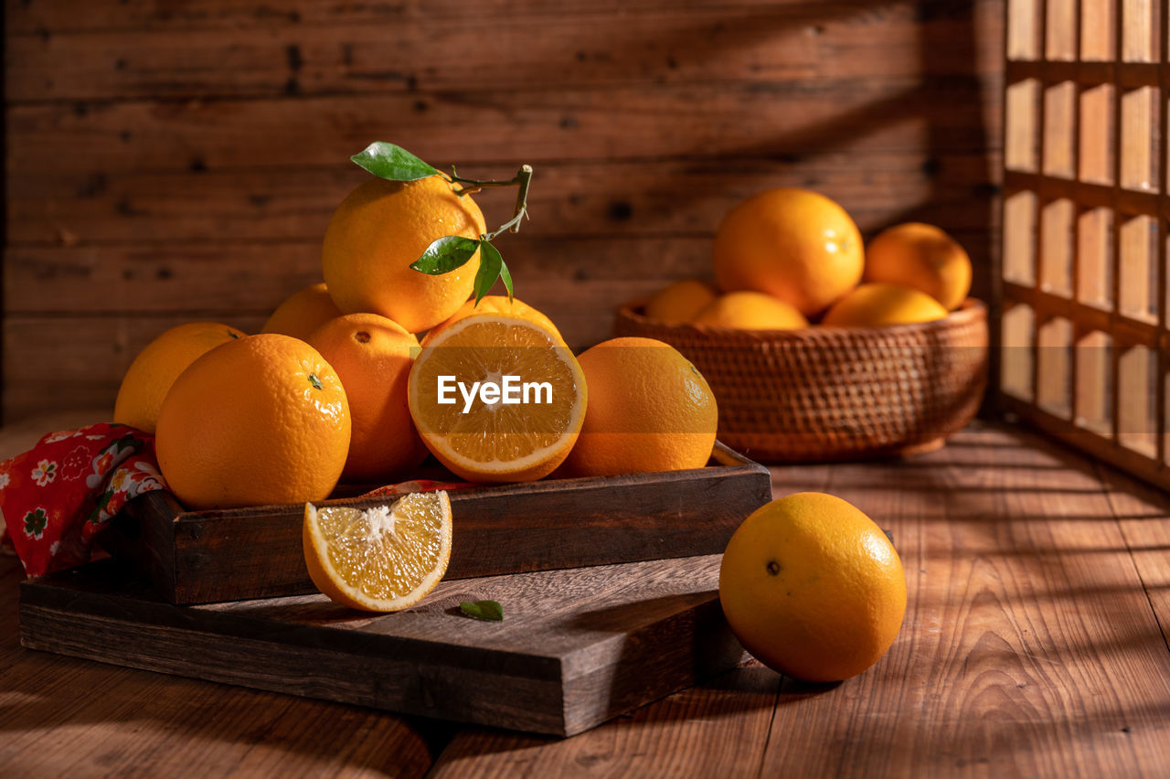 food and drink, food, healthy eating, fruit, citrus fruit, wellbeing, wood, tangerine, freshness, produce, orange color, orange, clementine, citrus, no people, blood orange, still life photography, grapefruit, container, basket, plant, yellow, rustic, indoors, nature, lemon, still life, painting, table, studio shot