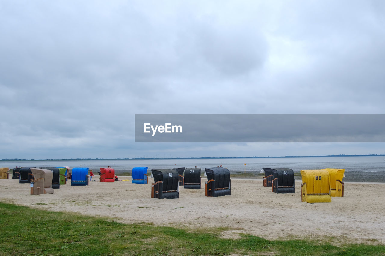 HOODED CHAIRS ON BEACH