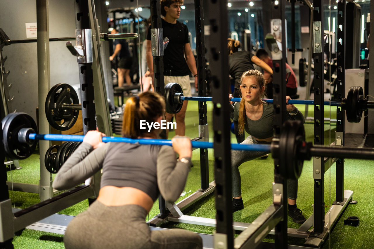 Young woman exercising in gym