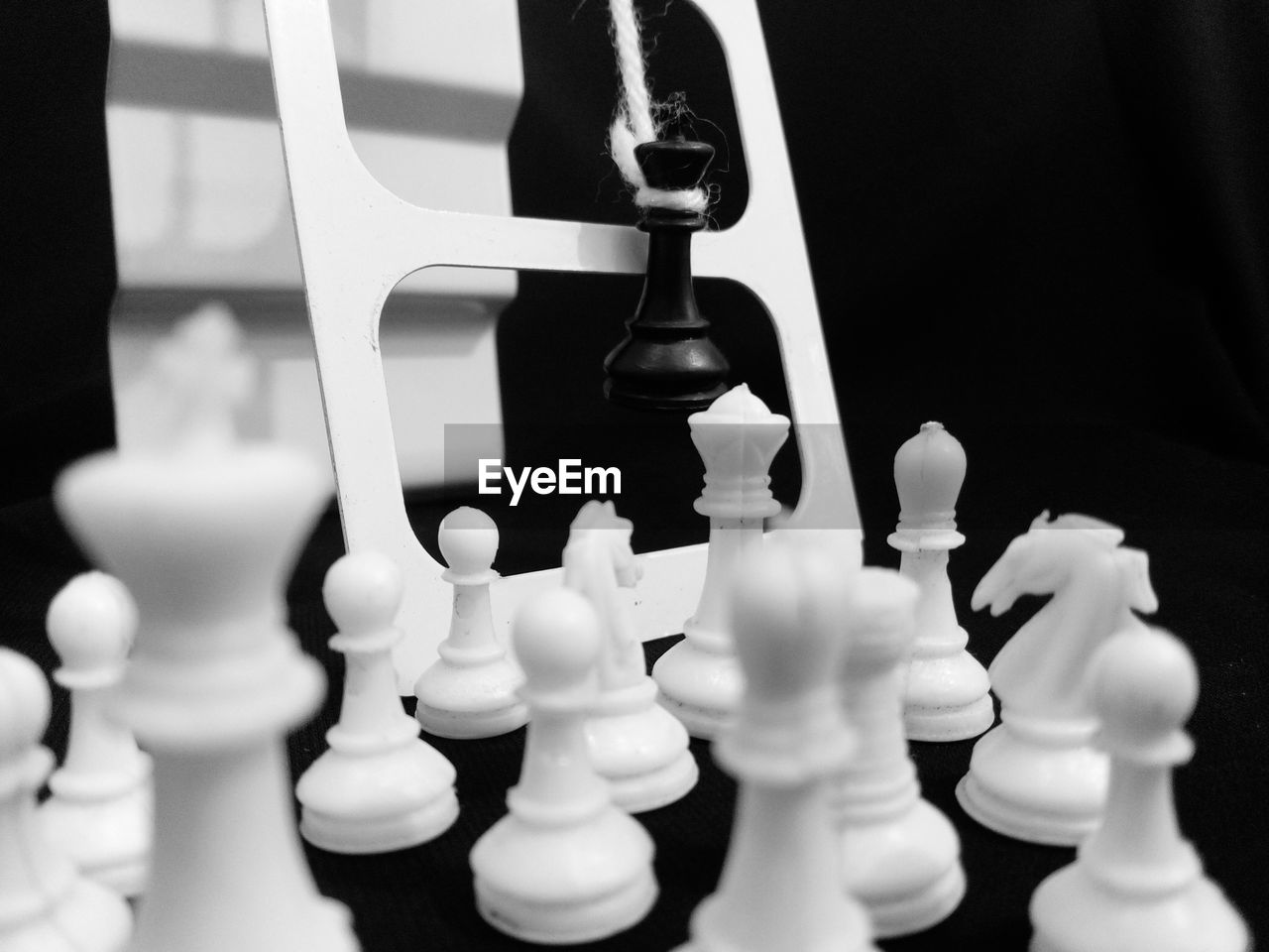 Close-up of chess pieces on table