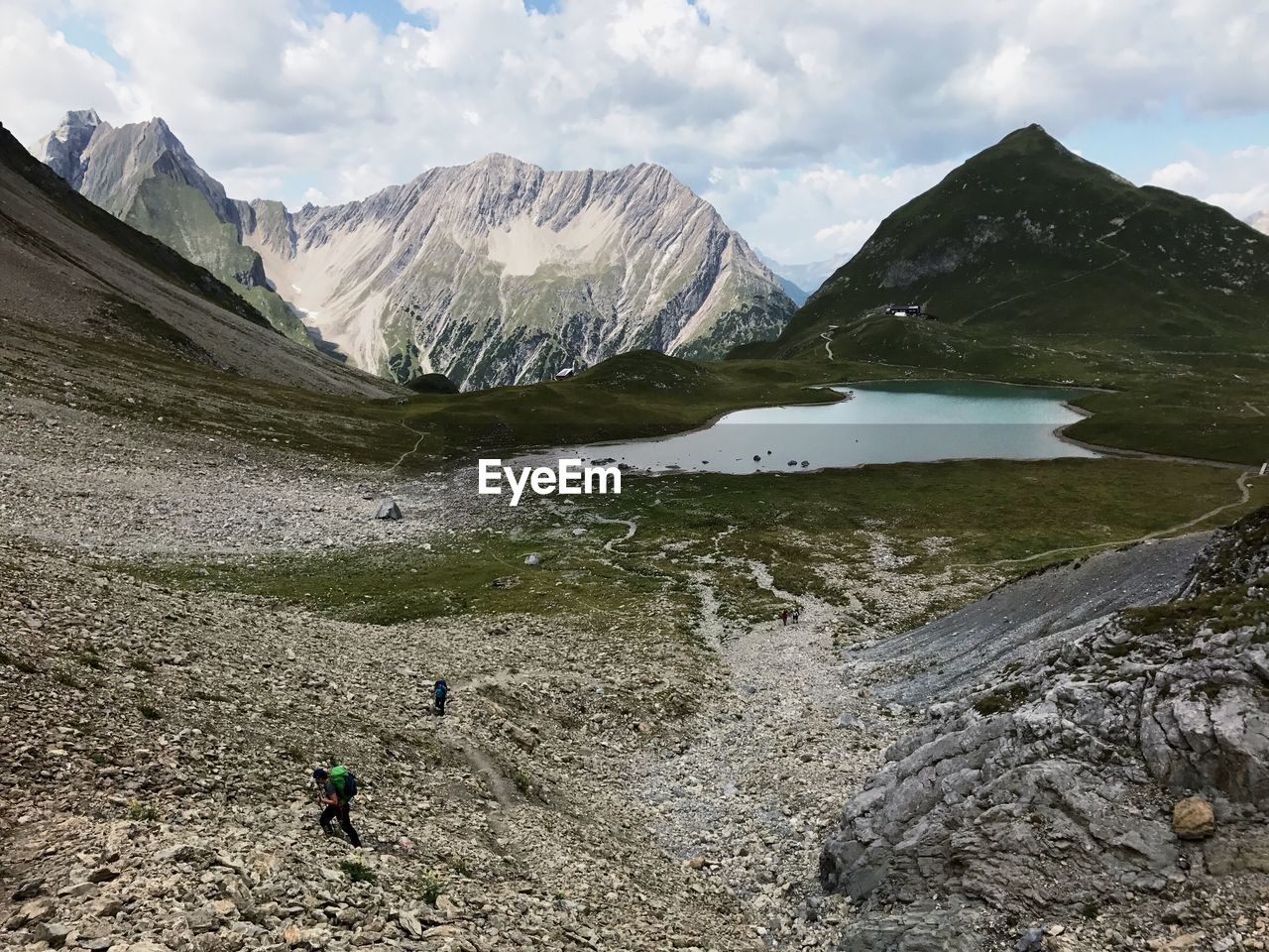 SCENIC VIEW OF SNOWCAPPED MOUNTAINS BY LAKE AGAINST SKY