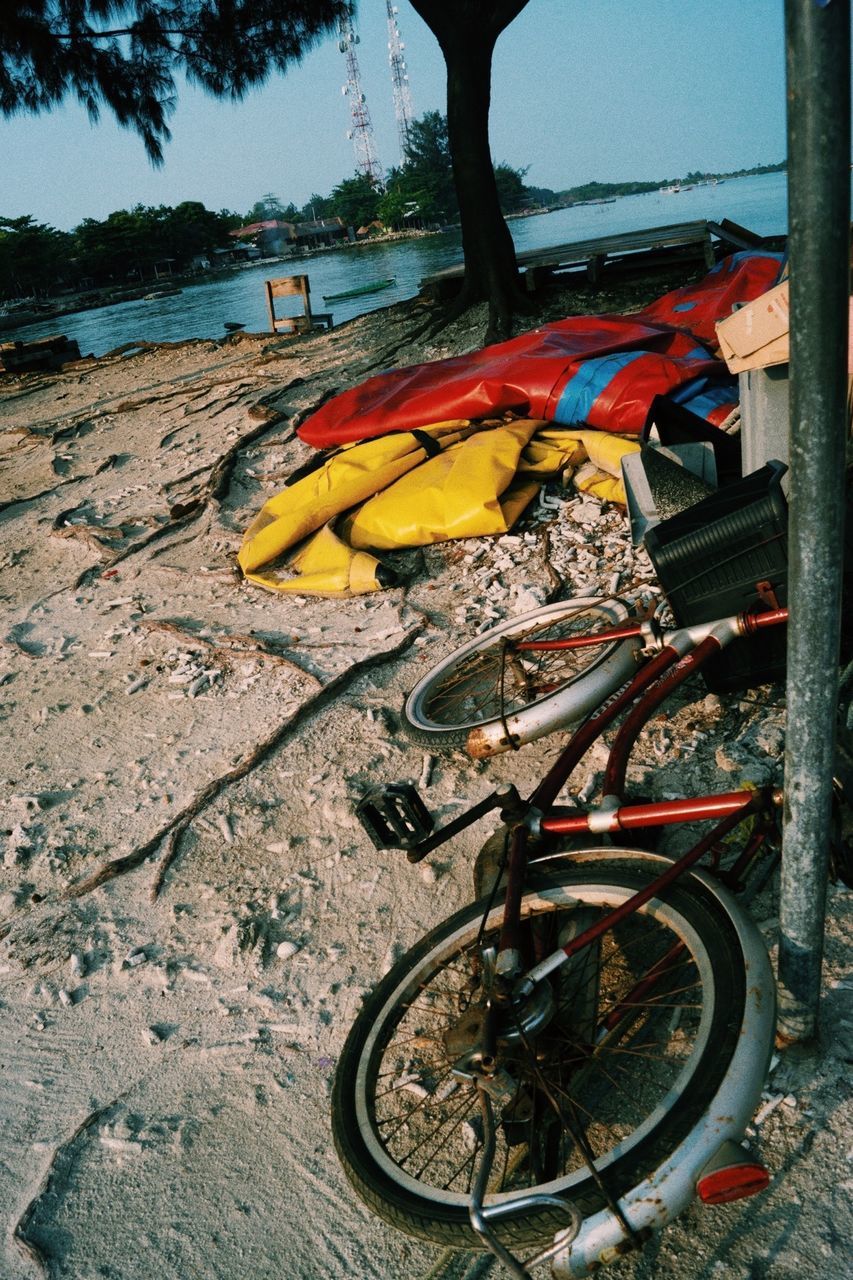 LOW SECTION OF PEOPLE ON BICYCLE BY WATER