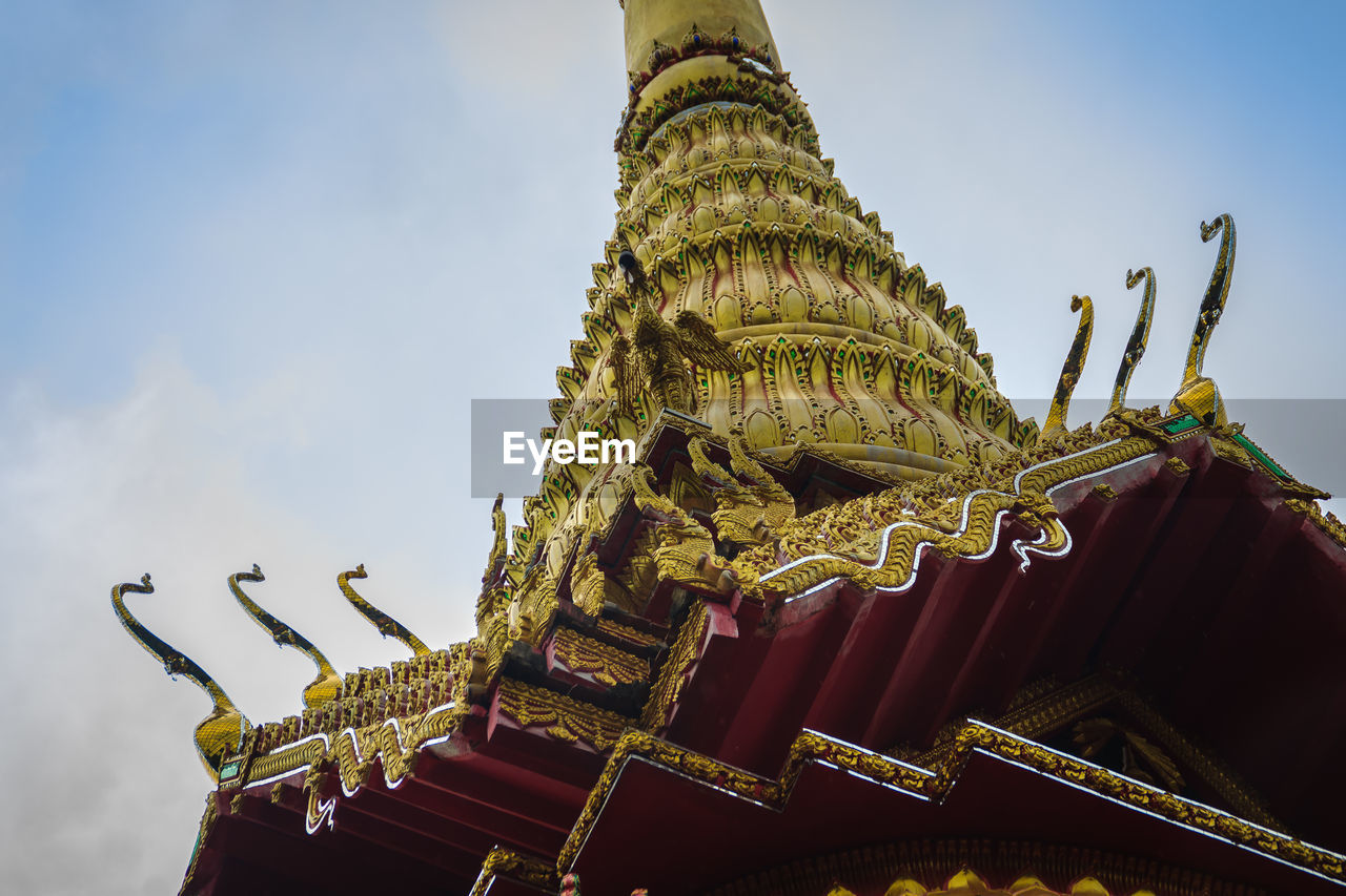 LOW ANGLE VIEW OF TEMPLE ON BUILDING