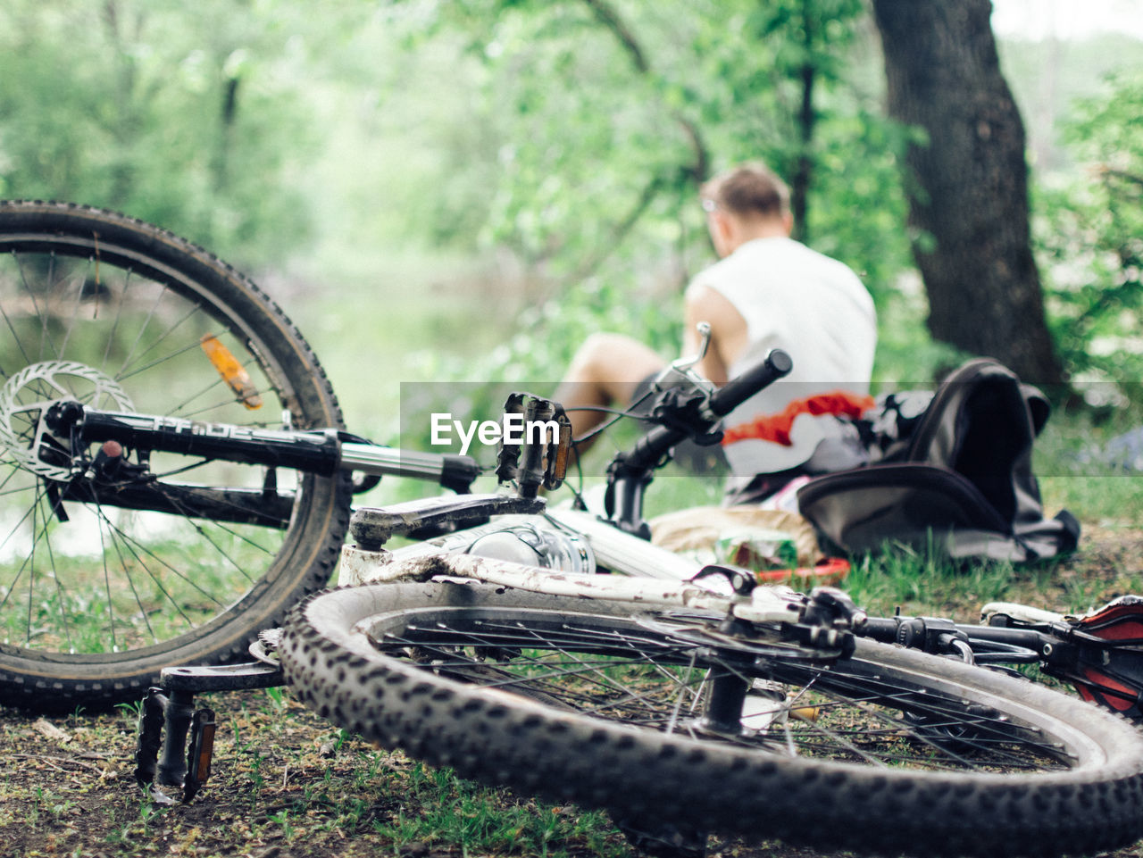 Close-up of bicycle with man in background
