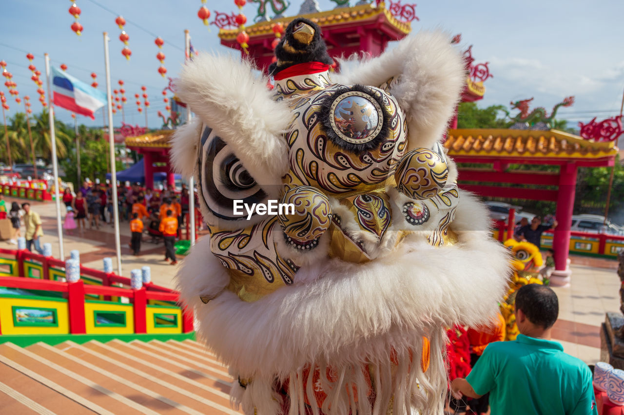 CLOSE-UP OF TRADITIONAL CLOTHING AGAINST SKY