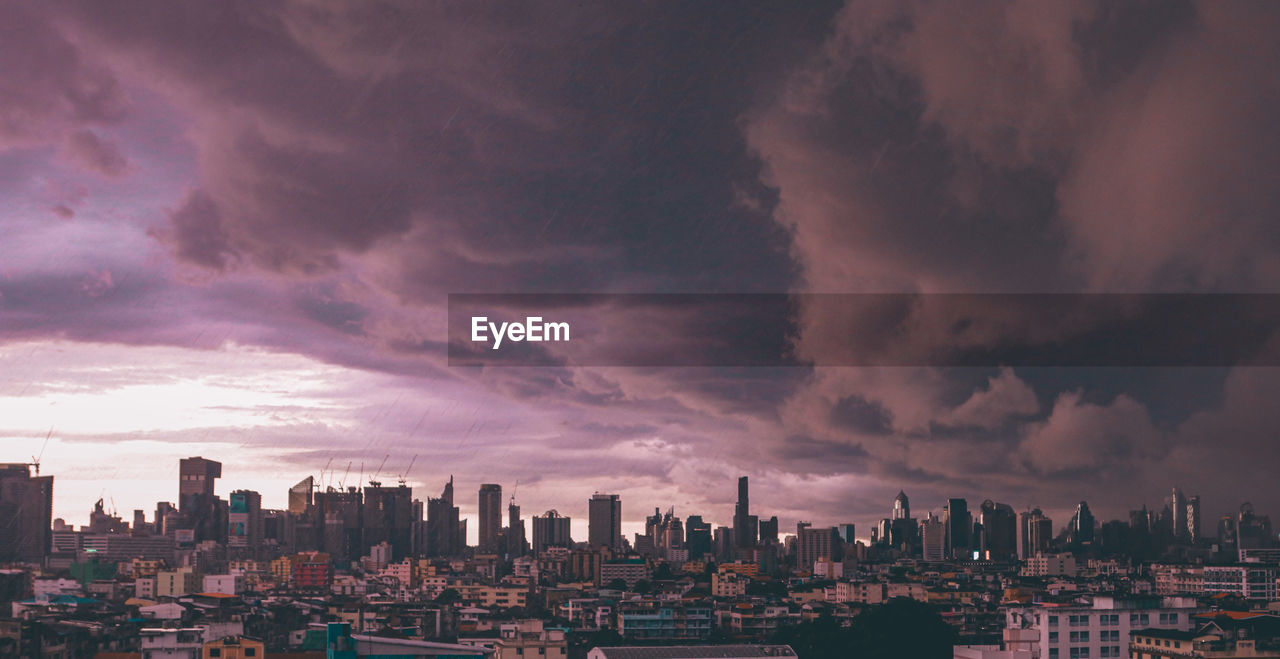 Panoramic view of buildings against sky during sunset