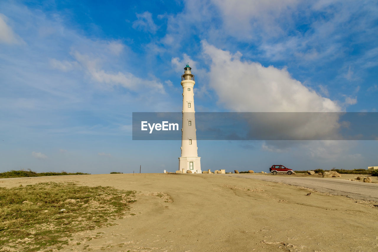 LOW ANGLE VIEW OF LIGHTHOUSE AGAINST SKY ON CLOUDY DAY