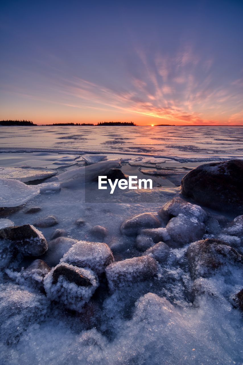 SCENIC VIEW OF SEA DURING WINTER AGAINST SKY