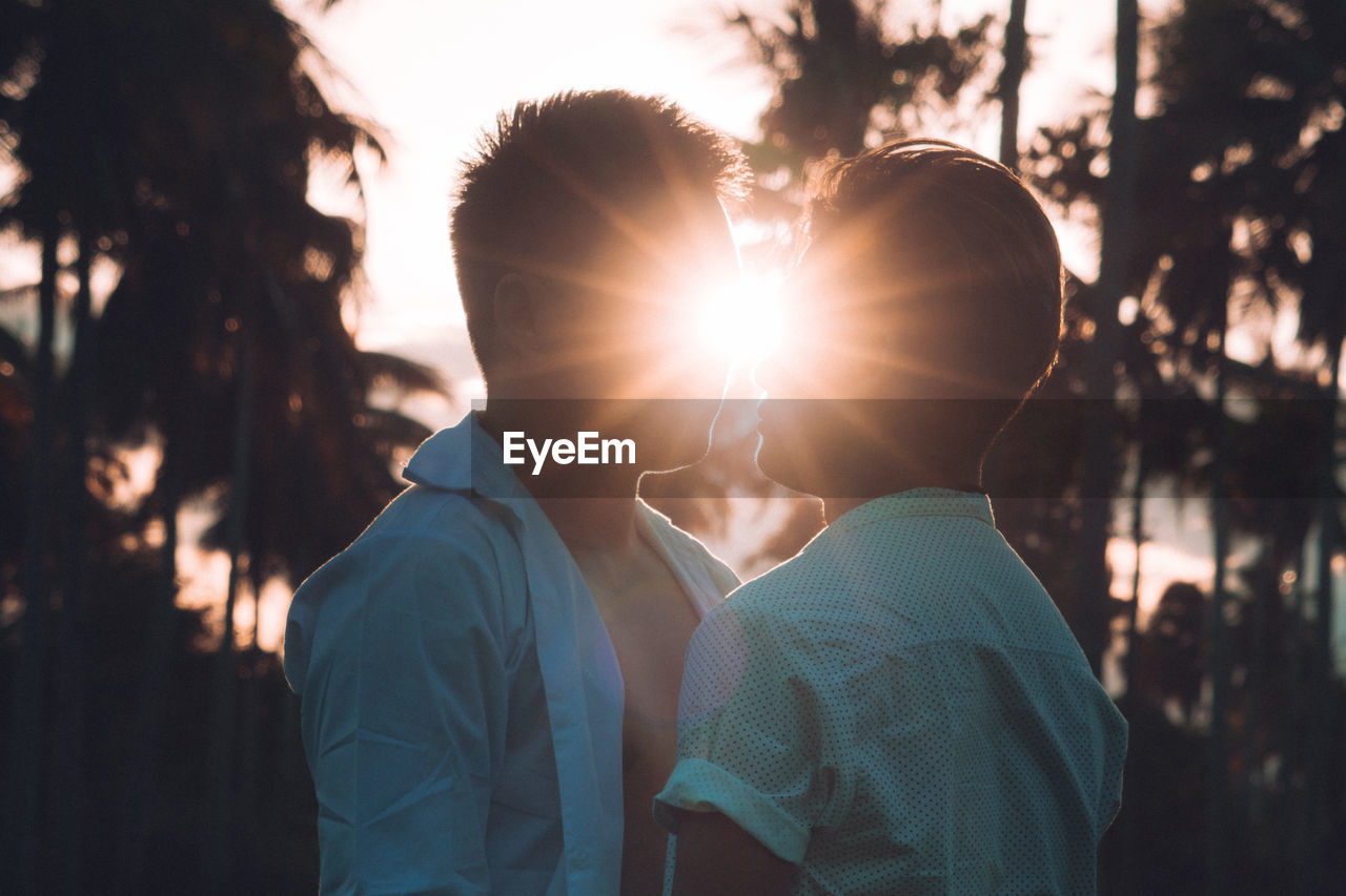 PORTRAIT OF COUPLE WITH SUN