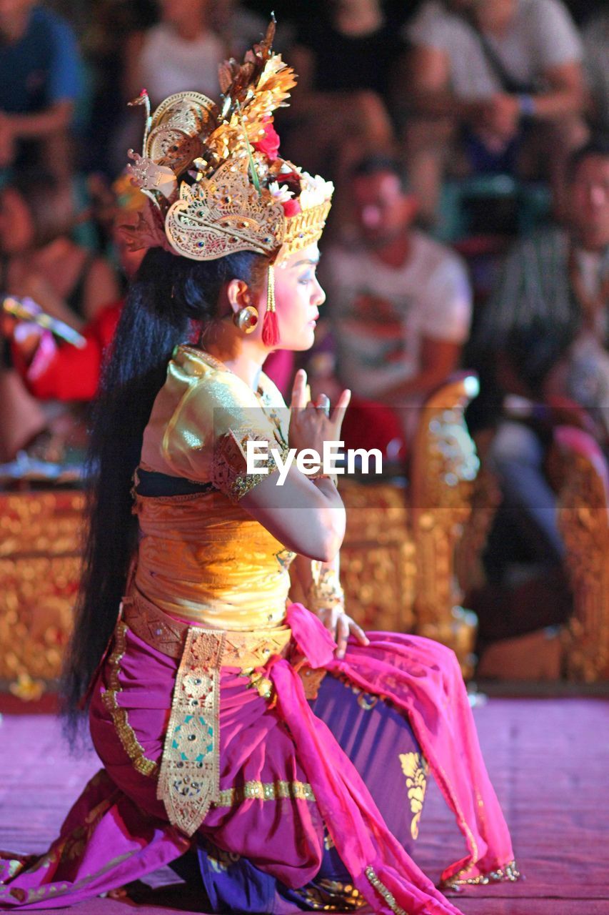 Woman in traditional clothing dancing