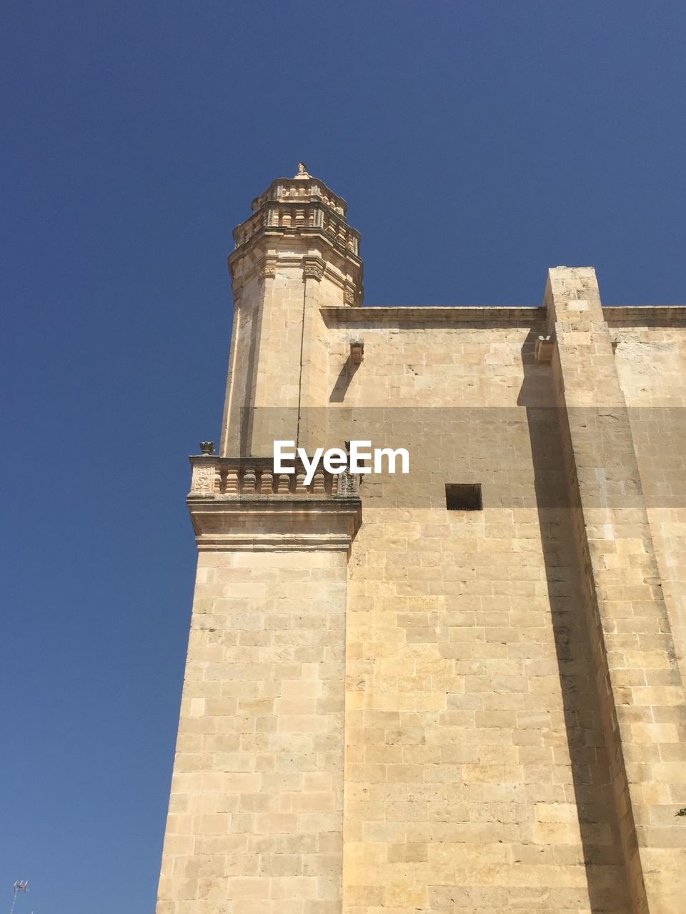 LOW ANGLE VIEW OF TOWER AGAINST CLEAR SKY