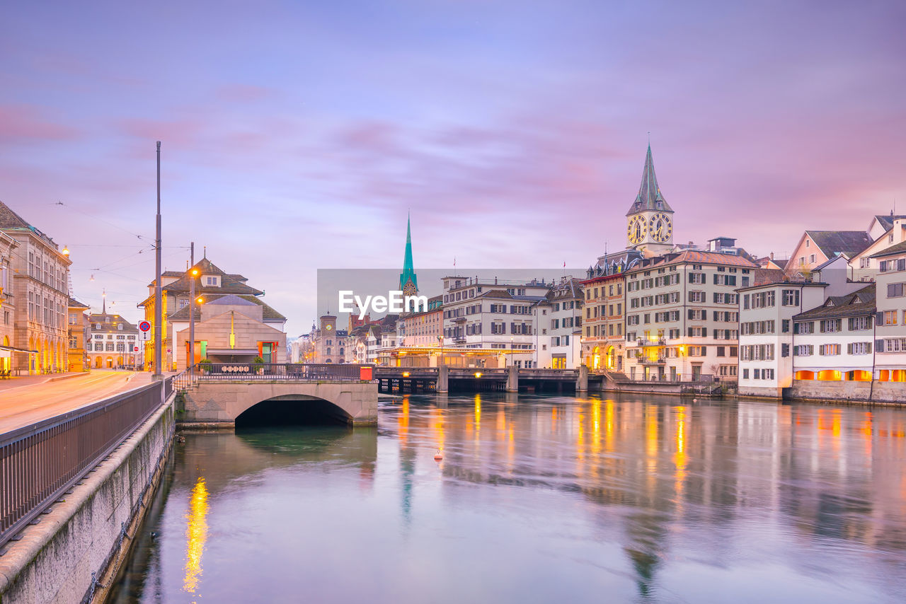 Cityscape of downtown zurich in switzerland during dramatic sunset.