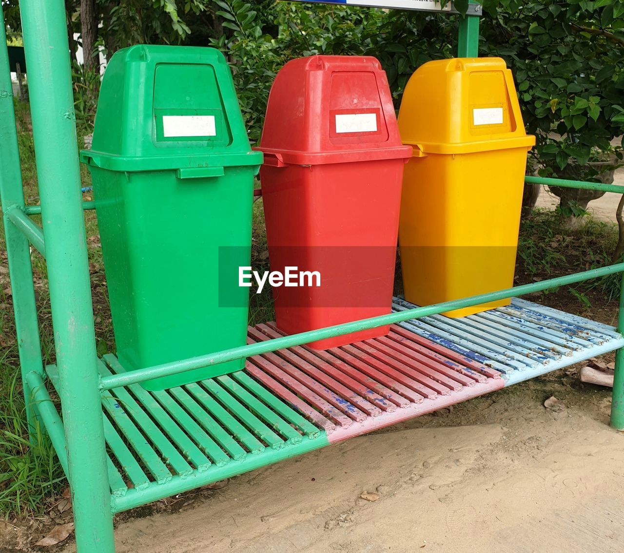 HIGH ANGLE VIEW OF MULTI COLORED DECK CHAIRS ON TABLE