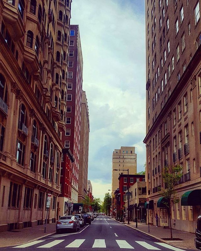 VIEW OF CITY STREET AGAINST SKY