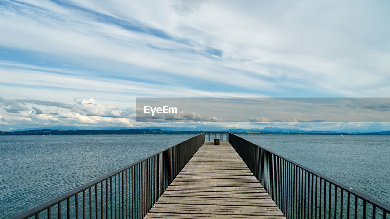 Pier over sea against sky