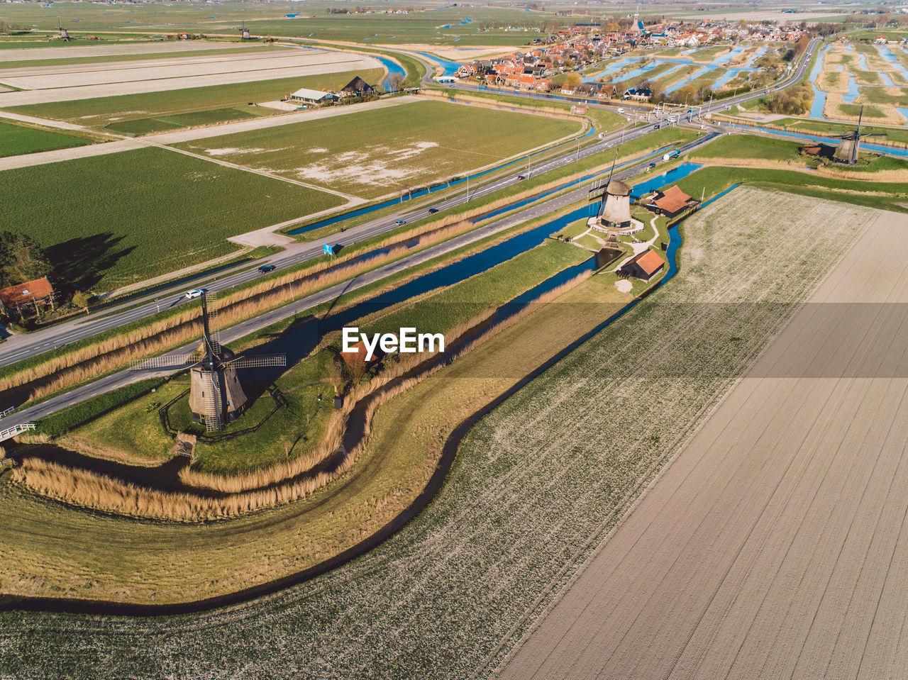 High angle view of windmills on agricultural field