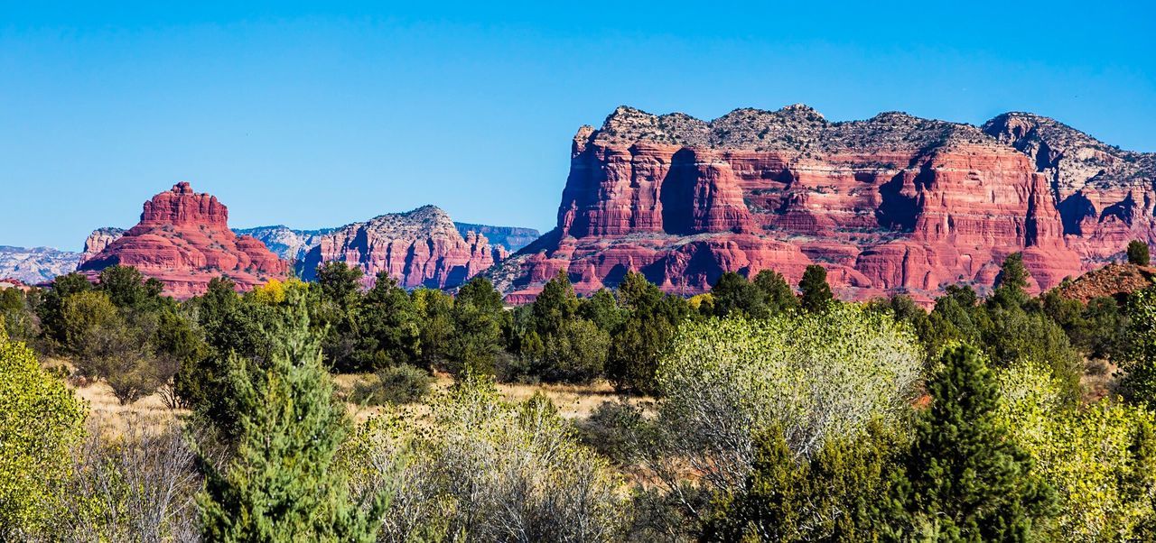 View of rocky mountain against blue sky