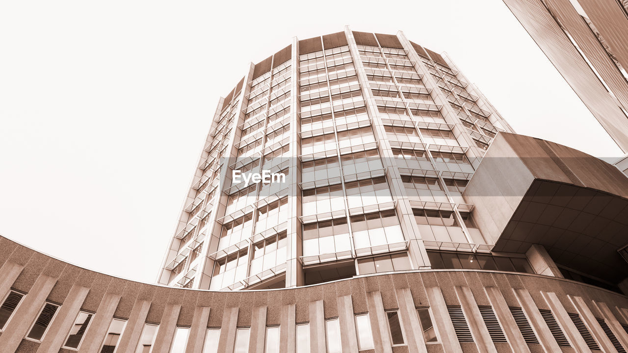 architecture, built structure, building exterior, city, building, office building exterior, office, skyscraper, low angle view, business, landmark, sky, window, no people, tower block, residential district, nature, finance, outdoors, glass, facade, line, travel destinations, city life, tower, downtown district, corporate business, business finance and industry, downtown, clear sky