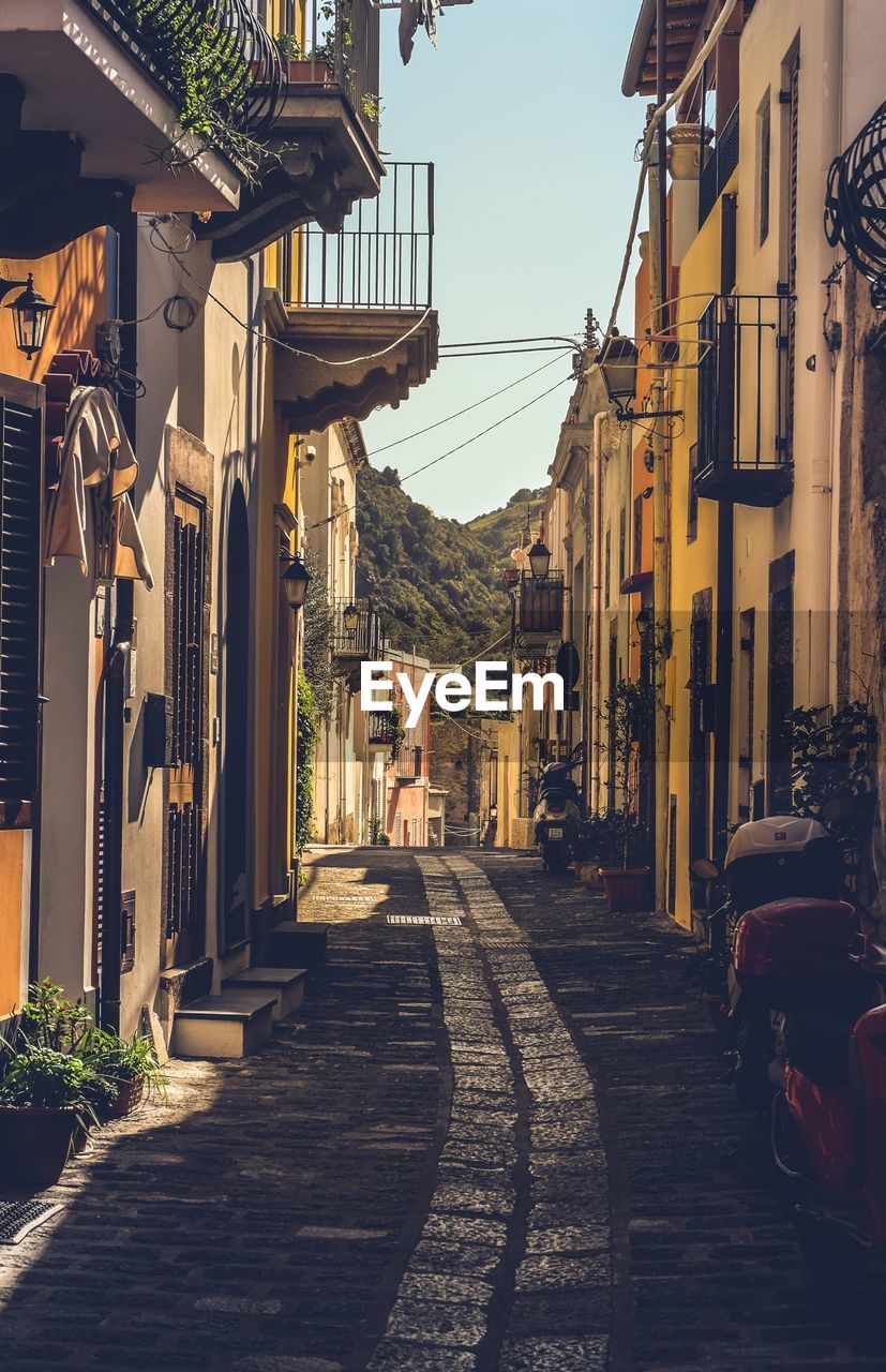 Narrow alley amidst buildings in city