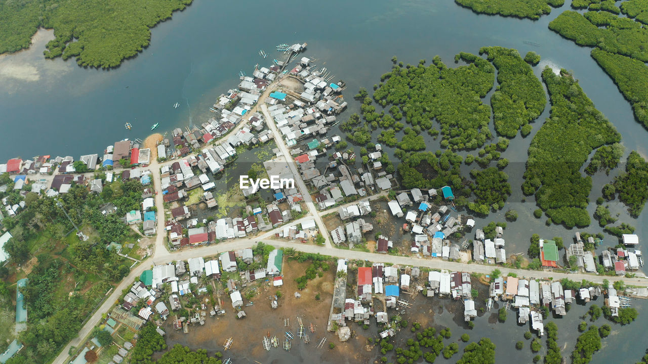 high angle view of trees and buildings against sky