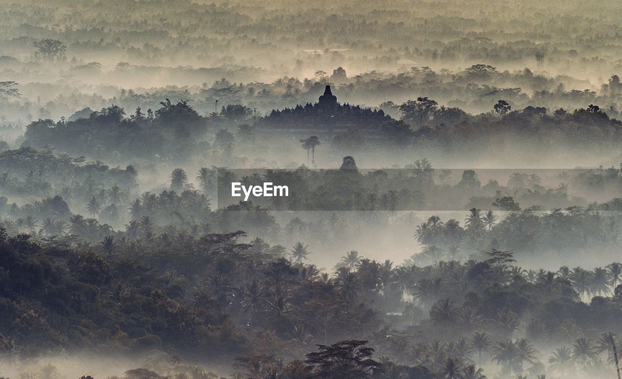 Scenic view of borobudur temple against sky during foggy weather