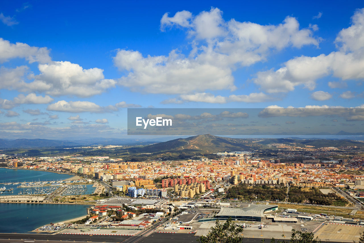 Cityscape and mountains against sky