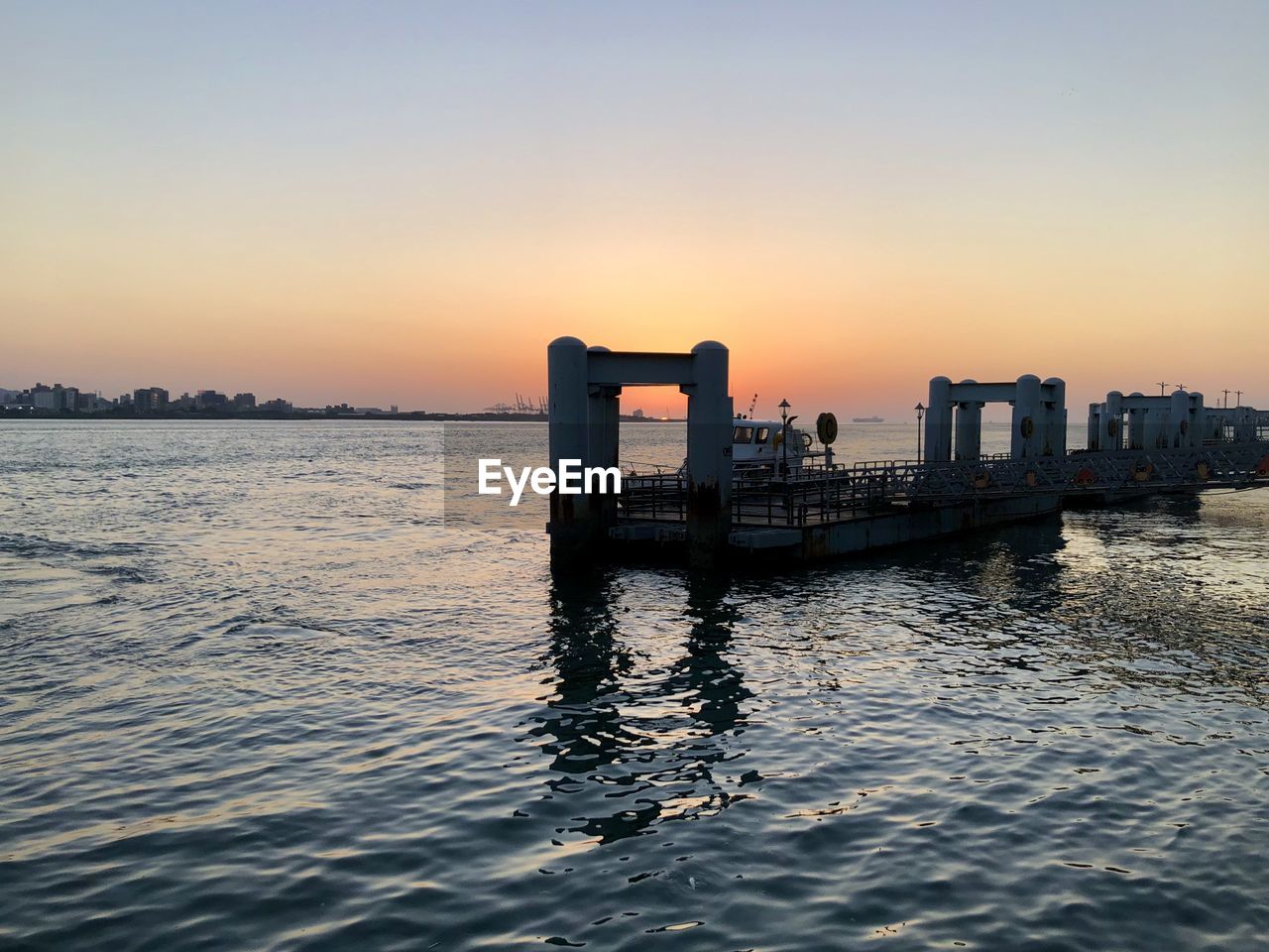 Scenic view of sea against clear sky during sunset