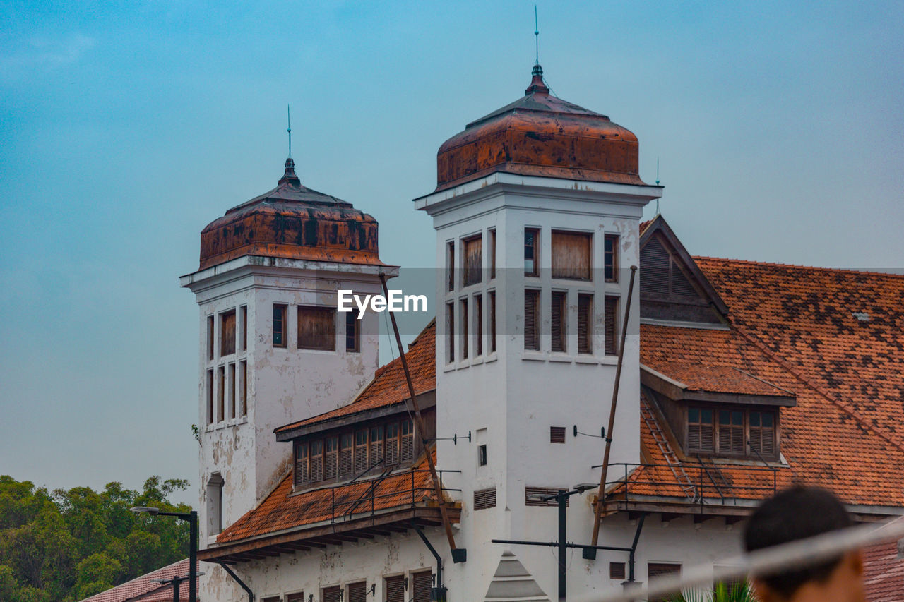 Low angle view of buildings against sky in jakarta 