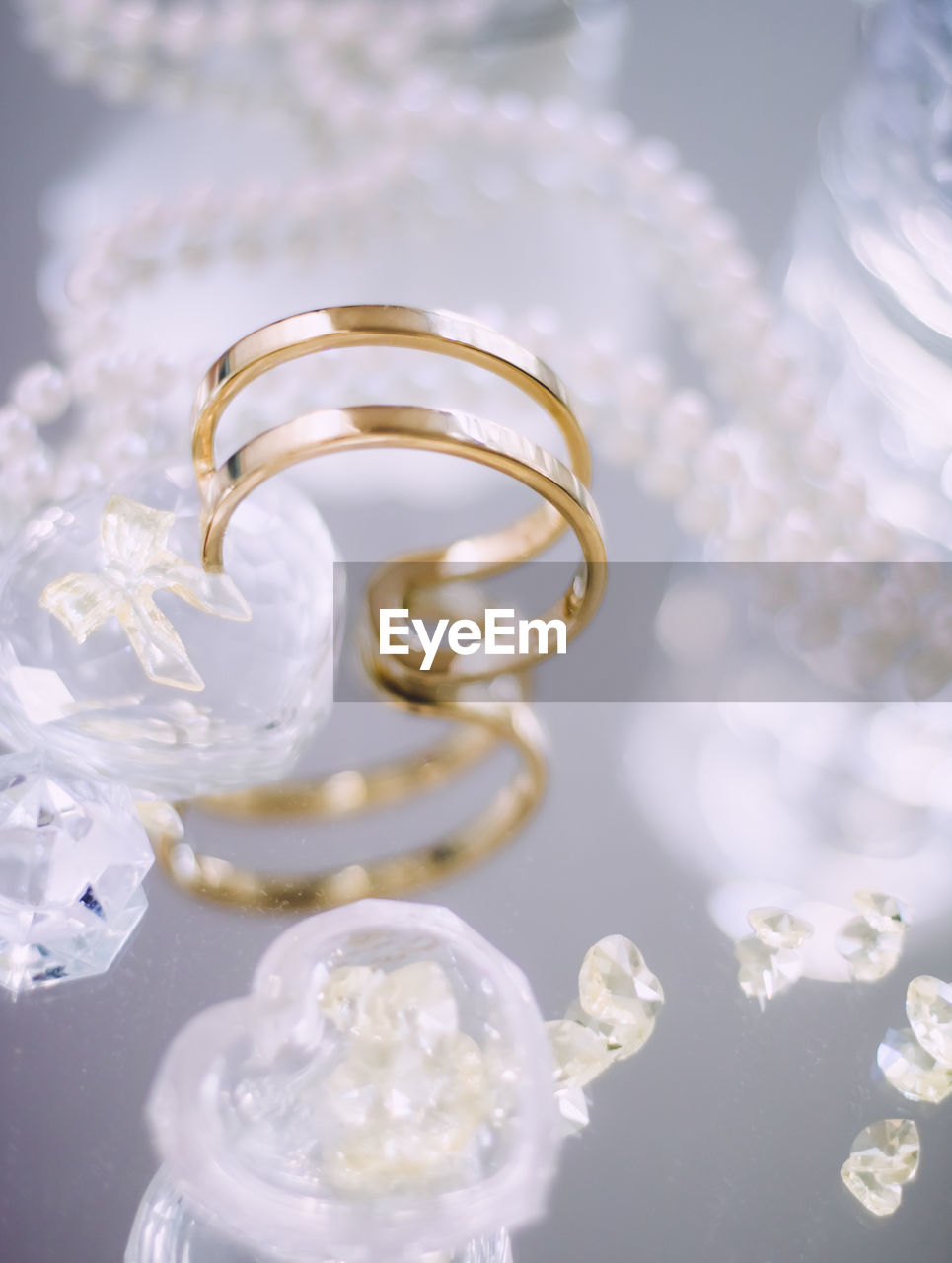 close-up of wedding rings on table