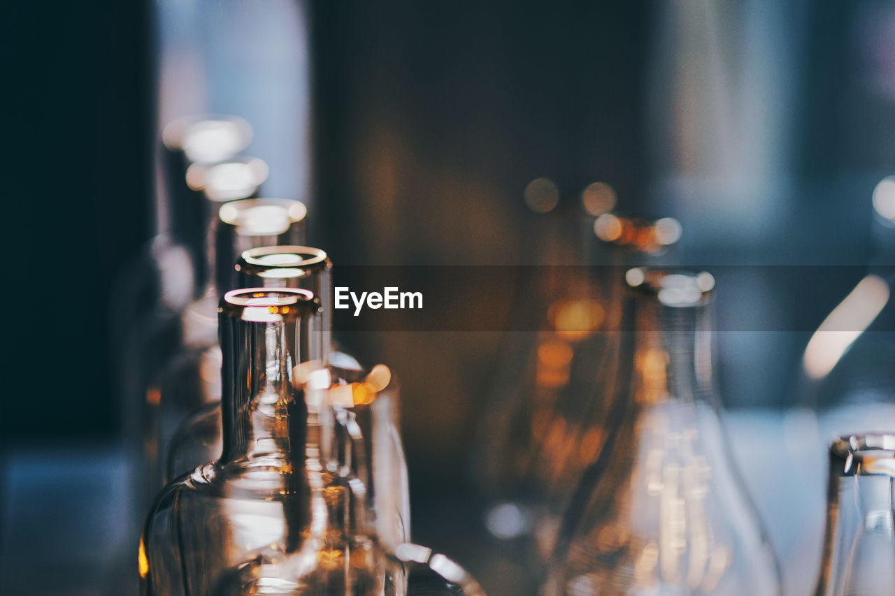 alcoholic beverage, drink, bottle, food and drink, no people, container, glass, focus on foreground, indoors, light, close-up, refreshment, alcohol, selective focus, lighting