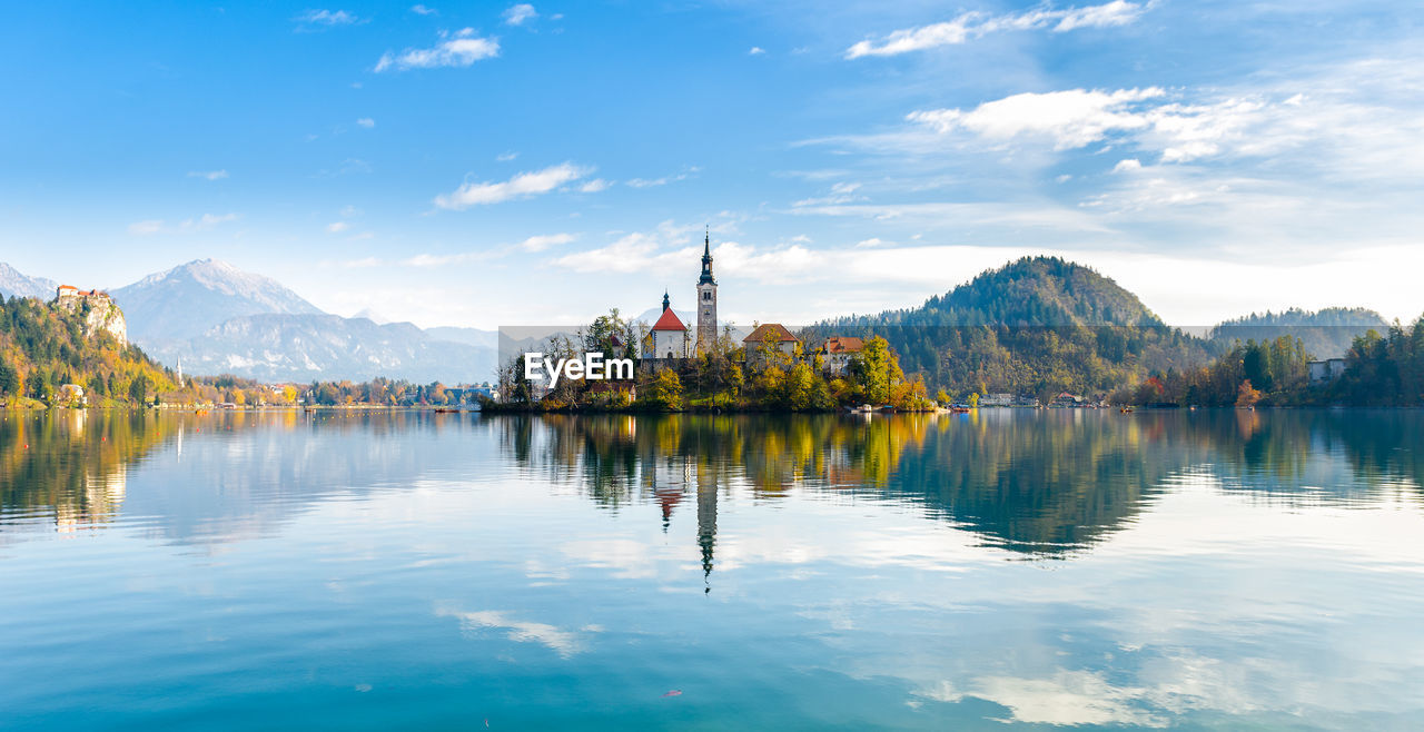 Scenic view of lake against cloudy sky