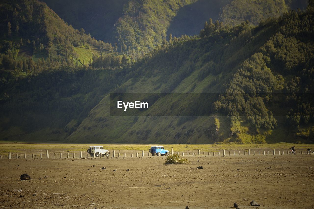 SCENIC VIEW OF LAND AND MOUNTAINS