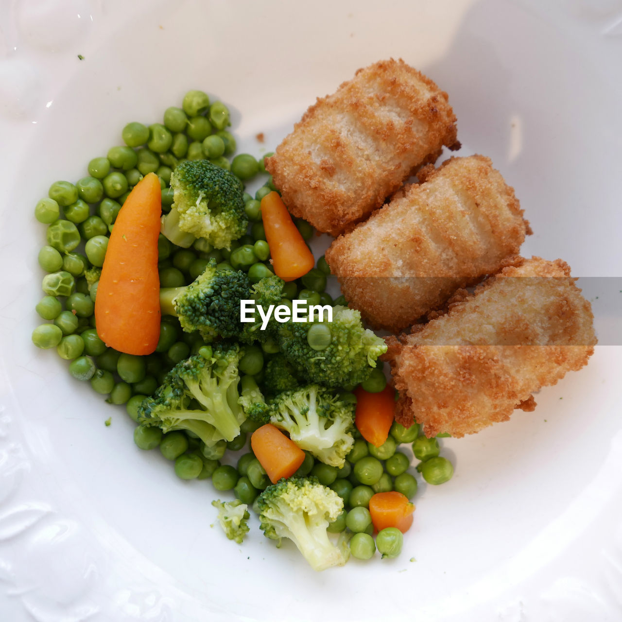 Directly above shot of vegetables with croquettes in plate