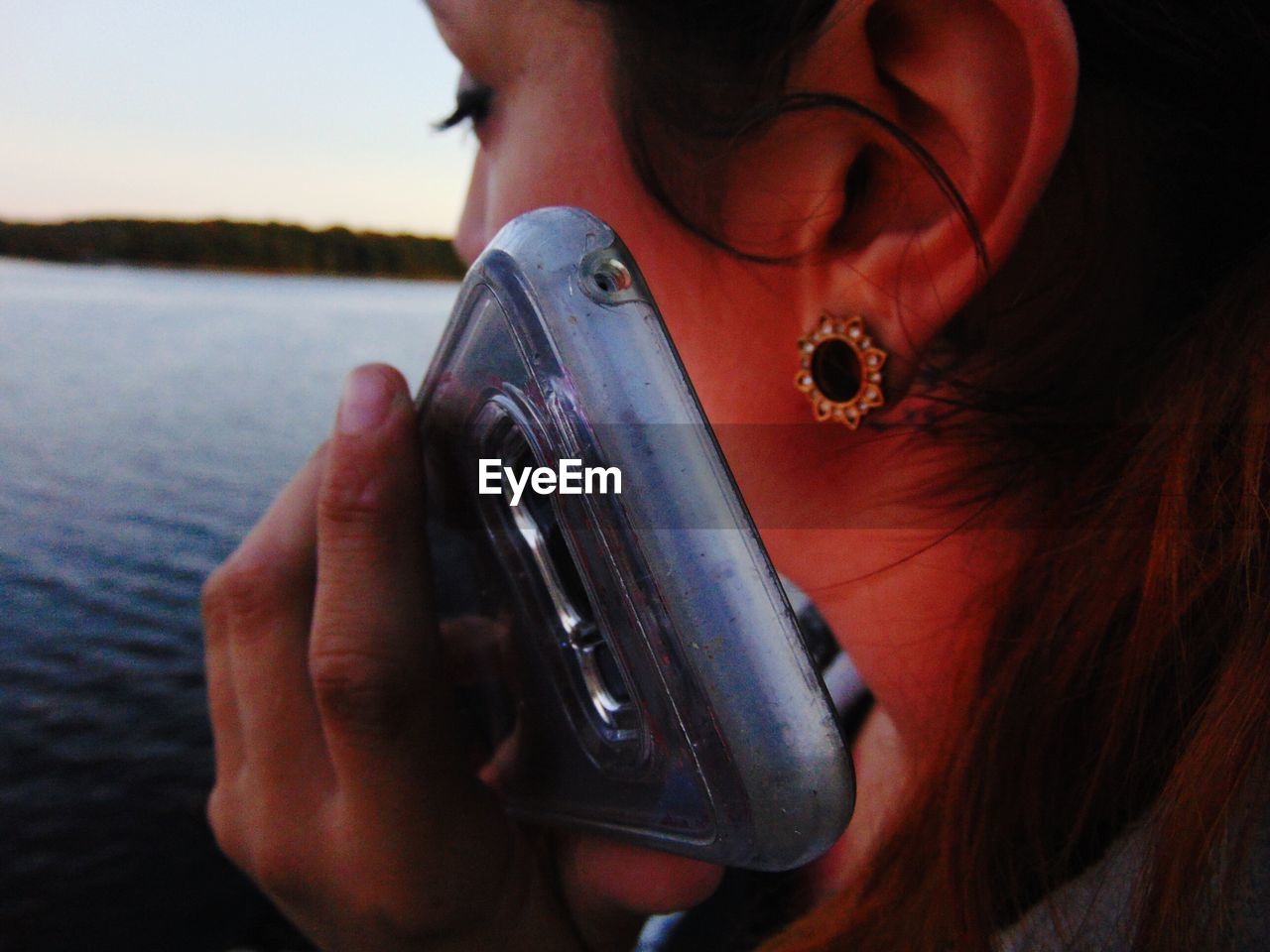 Close-up of man holding smart phone