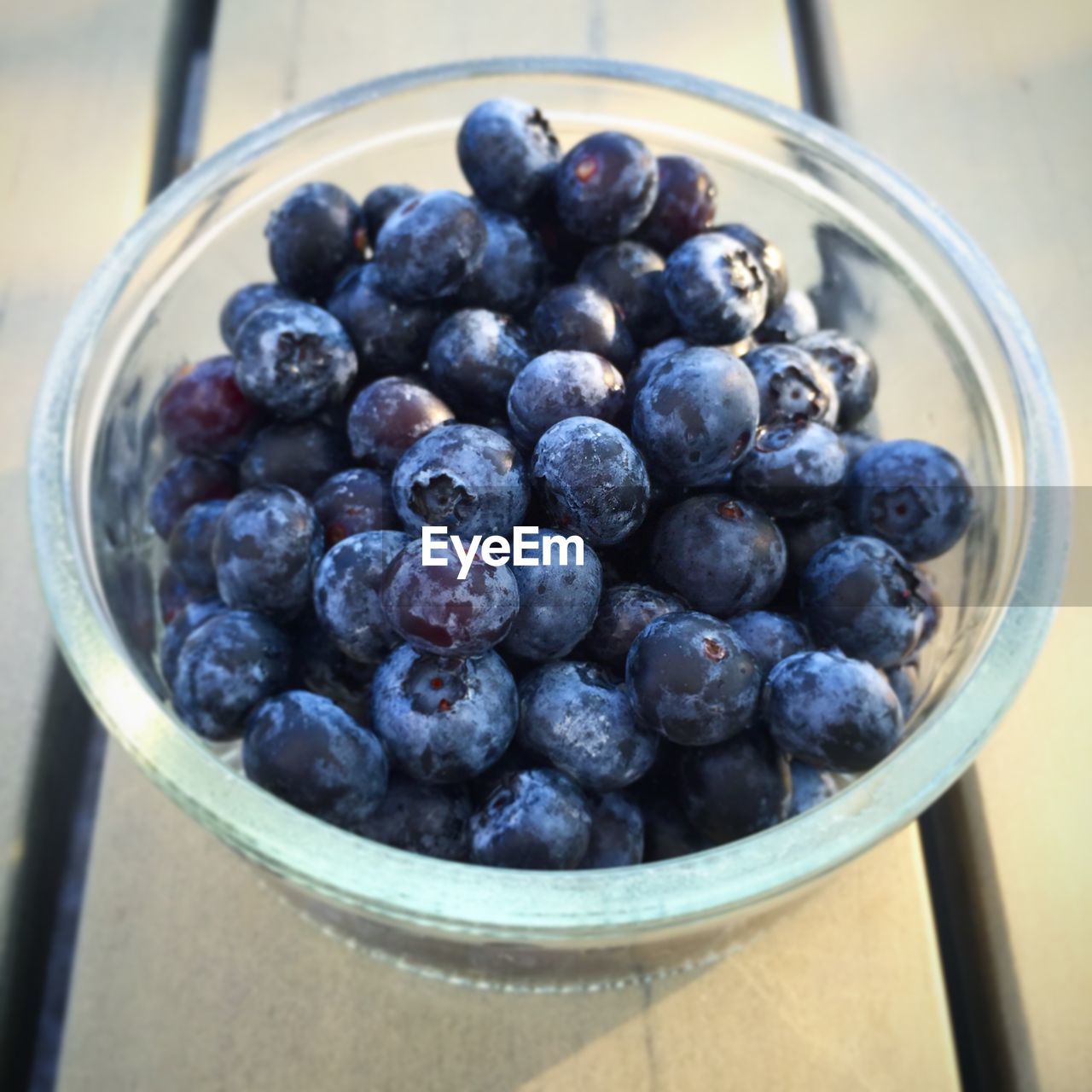 High angle view of blueberries in container on table